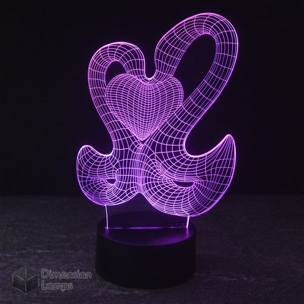 Vibrant purple LED Illusion lamp featuring two swans forming a heart, a graceful and affectionate lighting choice.