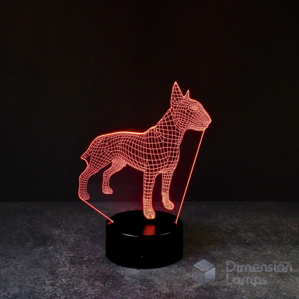 A wireframe 3D Bull Terrier lamp, recognised by its muscular body and uniquely shaped head, with a bright red illumination defining its structure against a dark background, placed on a black base. A thoughtful gift for dog lovers and Bull Terrier owners in Australia.