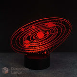 A red 3D lamp displays an etched design of the solar system with planets orbiting the sun, illuminated on a black base against a dark backdrop. A nightlight for boys rooms across Australia. 