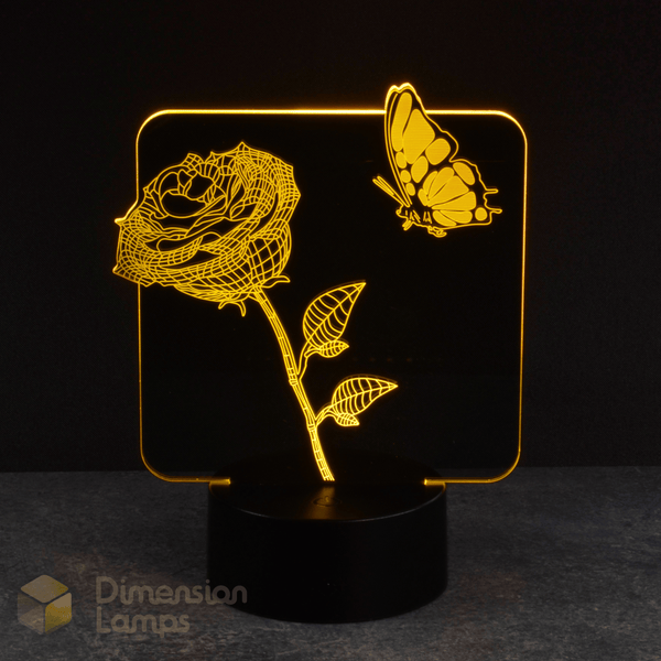 This yellow rose and butterfly 3D lamp creates a glowing floral and insect image. Serving as a distinctive nightlight, it adds a touch of nature's beauty to any room.