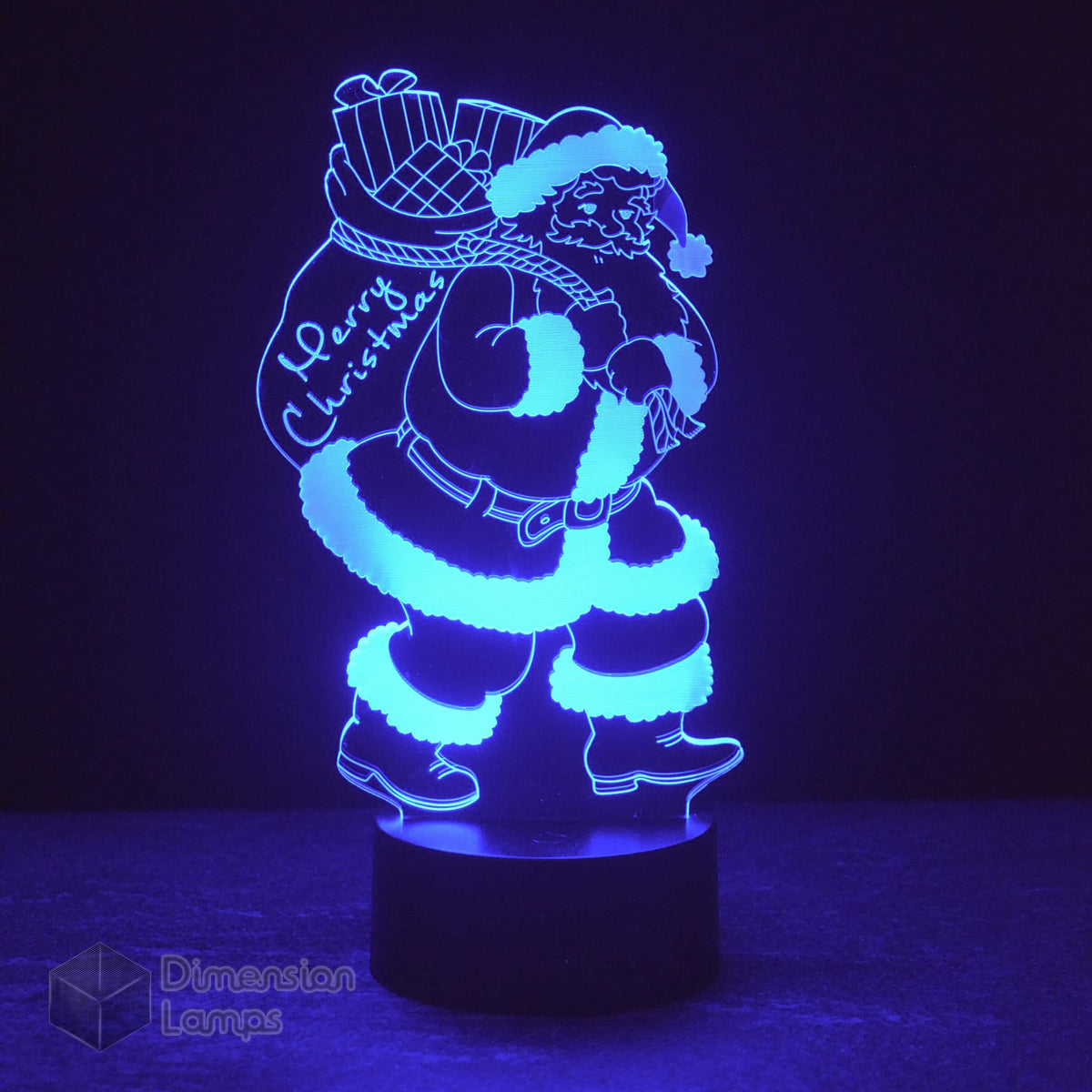 Blue Santa Claus 3D lamp: unique Christmas lighting. Features a detailed Santa figure with a "Merry Christmas" sack, ideal for distinctive seasonal decor. 