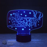 Blue Santa Sled 3D lamp: festive Christmas decoration. Features Santa Claus in a sleigh with reindeer, ideal for unique seasonal decor.