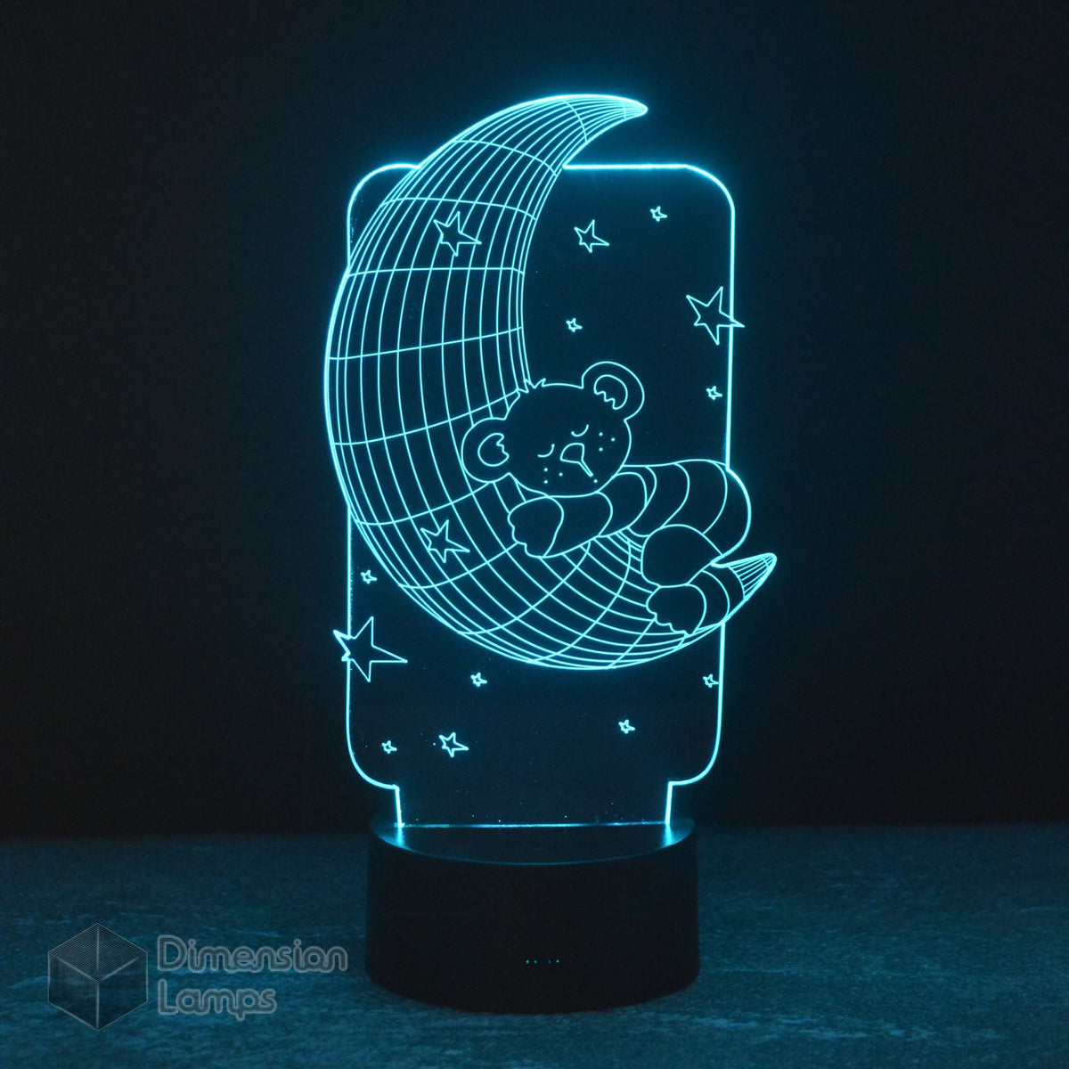 A 3D illusion lamp with a teddy bear sleeping on a crescent moon design, emitting a soothing cyan light, perfect as a calming nightlight. 