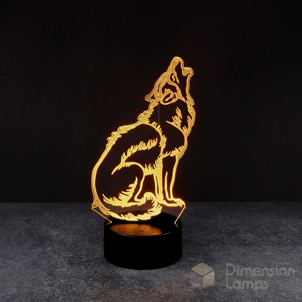 A 3D illusion lamp of a howling wolf, its form defined by yellow faceted planes, with its head raised and mouth open, on a black base against a dark background. Distinctive man cave decor for Australian homes.