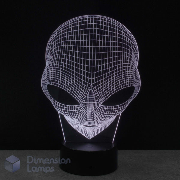 Alien head 3D illusion LED night light on a black base, shown against a dark background with a 'Dimension Lamps' watermark in the lower-left corner.