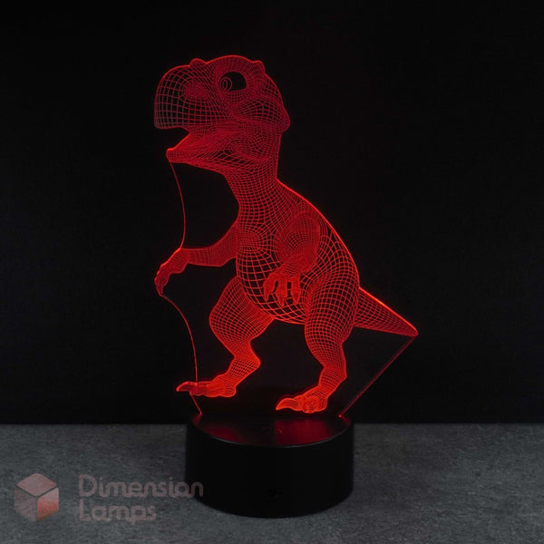 Red baby dinosaur-shaped lamp on a black background by Dimension Lamps.