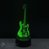 Bass guitar LED lamp glowing green on a black background with 'Dimension Lamps' branding. Present for bass player. 