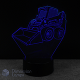 3D LED lamp shaped like a skid steer loader bobcat on a black background. Construction themed kids lamp.