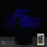 Motorcycle-shaped 3D lamp with remote control on a dark background