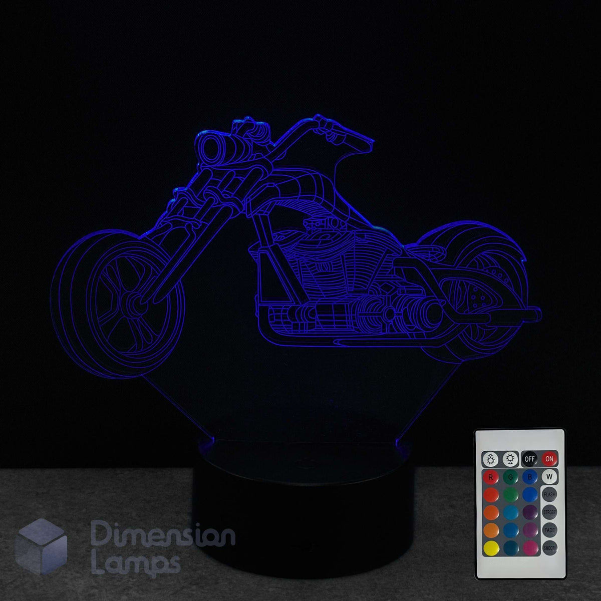 Motorcycle-shaped 3D lamp with remote control on a dark background