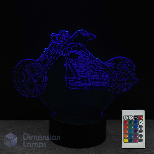 Motorcycle-shaped 3D lamp with remote control on a dark background