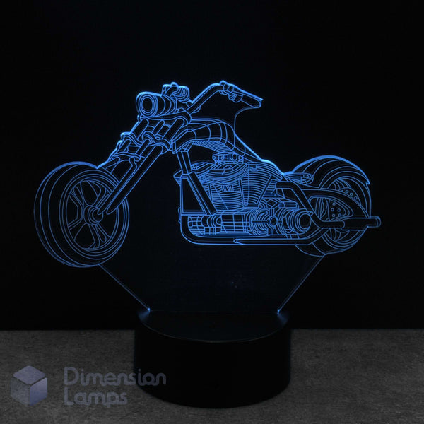 Chopper style motorbike 3D LED lamp with blue light on a black background.