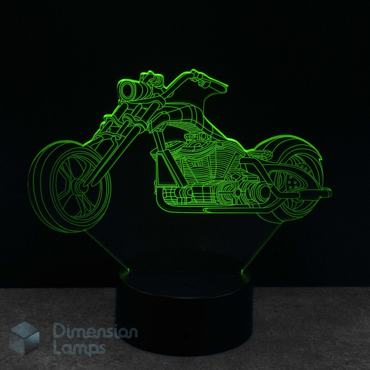 Motorcycle cruiser shaped night light with green outline on a black background
