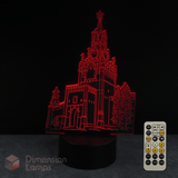 3D LED lamp with architectural design and remote control on a dark background