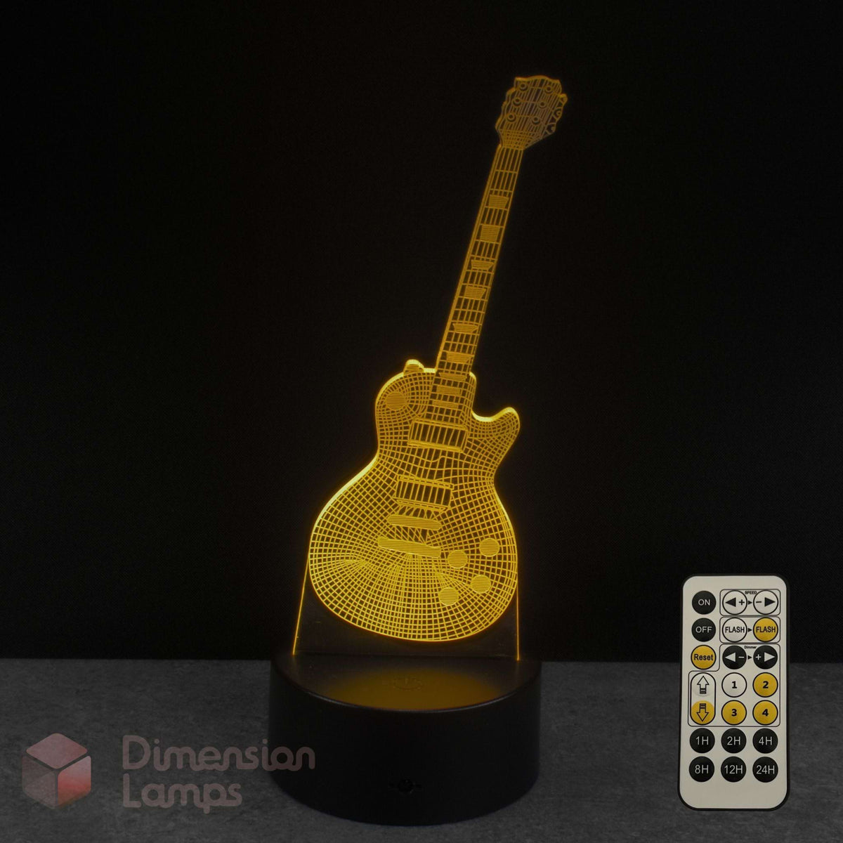 A 3D optical illusion LED night light of an electric guitar, glowing with a warm golden light, shown on a dark grey surface against a black background with a white remote control and a 'Dimension Lamps' logo watermark. Music teacher guitar gift.
