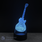 Cyan coloured Les Paul guitar-shaped LED lamp on a black background with 'Dimension Lamps' branding.
