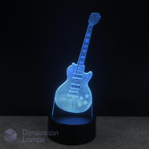 Cyan coloured Les Paul guitar-shaped LED lamp on a black background with 'Dimension Lamps' branding.