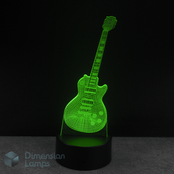 Guitar-shaped lamp emitting a green light. Lucille themed guitar gift idea.  