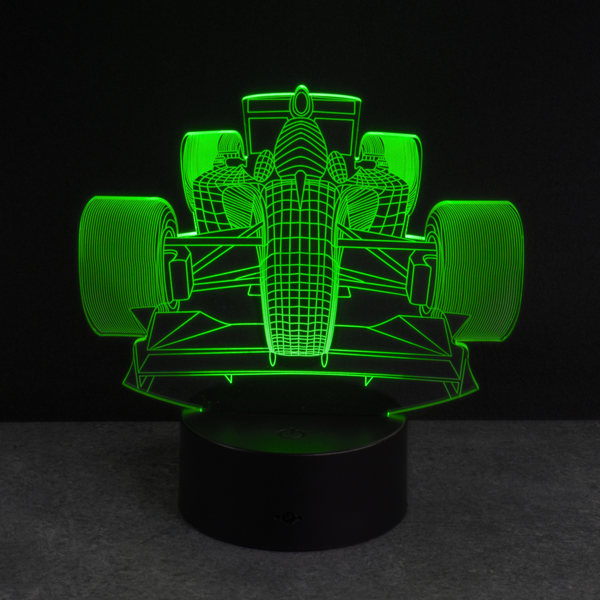 3D racing car lamp with green light on a black background, kids gift idea.