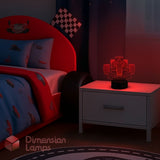 Yellow race car design lamp on a black background, nightlight for boys.