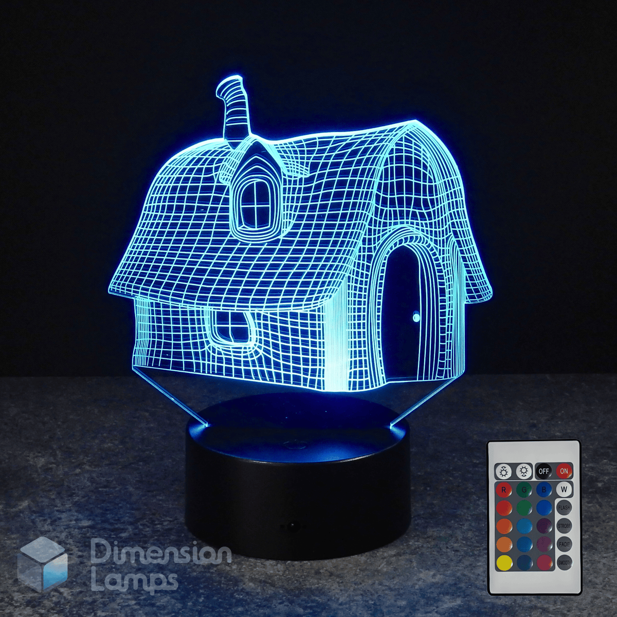 3D house-shaped night light with remote control on a dark background