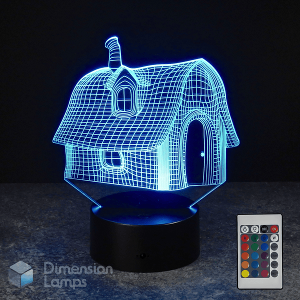 3D house-shaped night light with remote control on a dark background