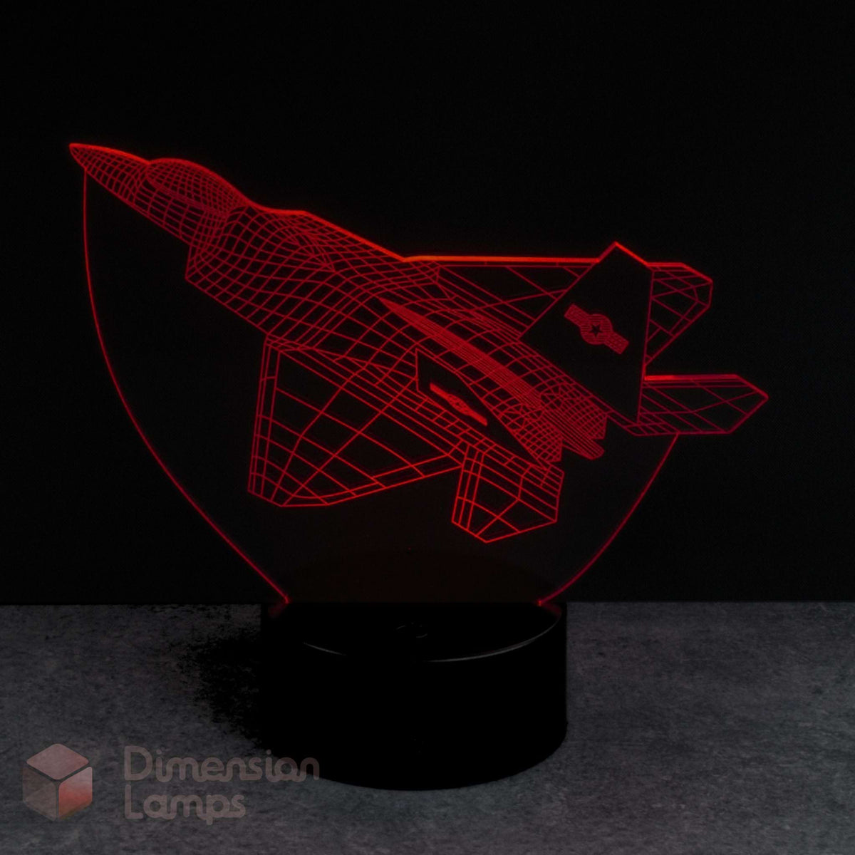 Red F22 Raptor jet airplane-shaped lamp on a dark background by Dimension Lamps Australia. 