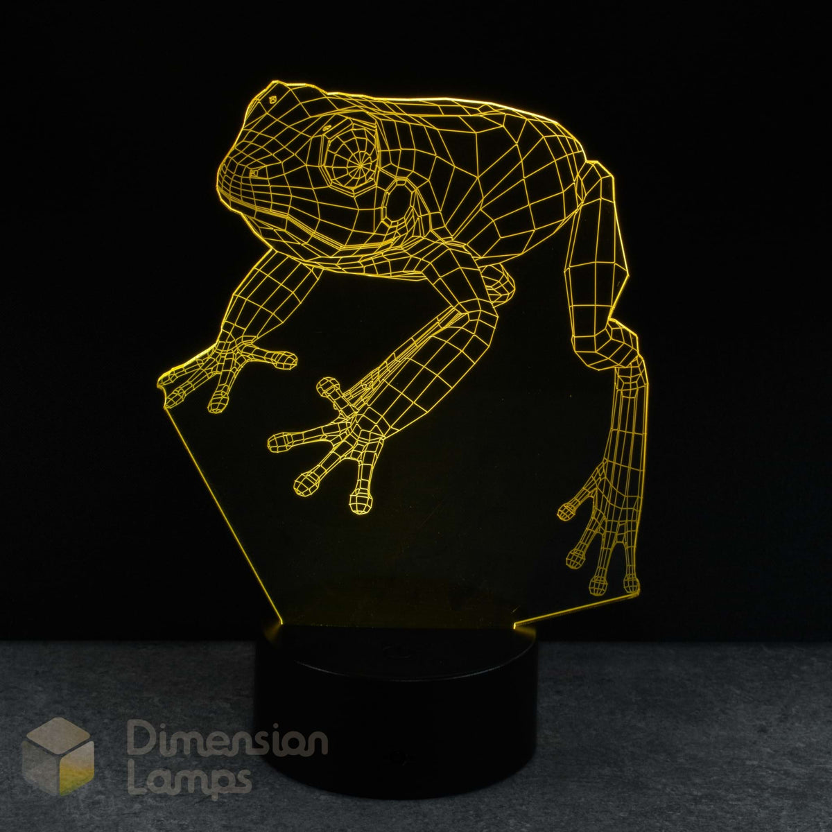 Frog-shaped yellow night light with a black background, frog lovers gift.