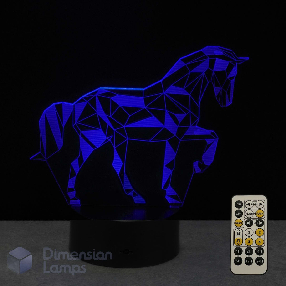 A 3D illusion lamp of a unicorn glowing blue with its 7 colour remote control on a dark background. An ideal gift for kids into unicorns and horses. 