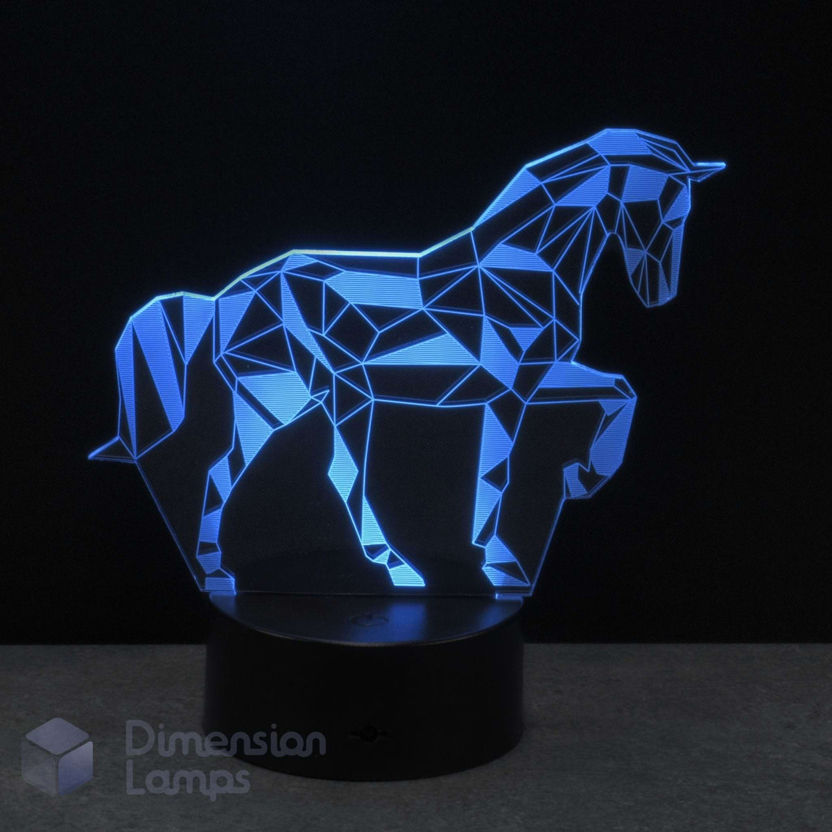 A 3D optical illusion LED night light of a unicorn, featuring a geometric polygonal design glowing cyan on a black base. A perfect unicorn gift idea.