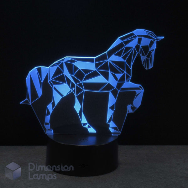 A 3D optical illusion LED night light of a unicorn, featuring a geometric polygonal design glowing cyan on a black base. A perfect unicorn gift idea.