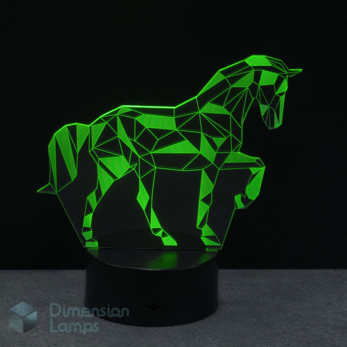 A modern geometric unicorn LED night light glowing green, shown on a black base against a dark background. Ideal gift for girls who love unicorns.