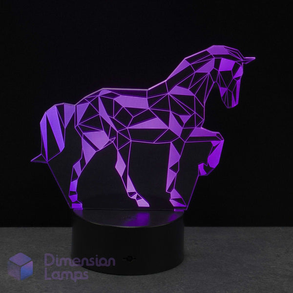 A geometric unicorn LED night light on a black base, glowing purple against a dark background. Girls unicorn gift idea. For girls into unicorns.