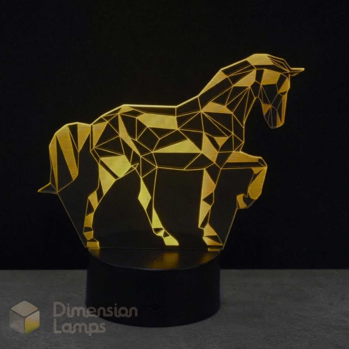A girls geometric unicorn LED night light in gold yellow acrylic on a black base, against a dark background. The name 'Dimension Lamps' in the corner.