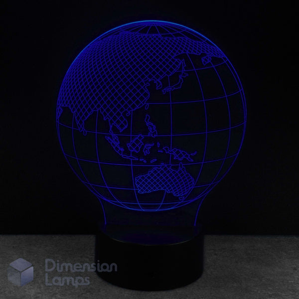 A 3D globe lamp glowing against a dark background. Kids 3d planet night light. 