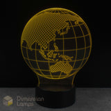 Glowing yellow globe-shaped lamp showing a 3d illusion of a globe on a black background.