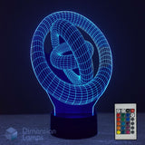 A 3D optical illusion lamp shaped like a stylized knot, glowing with a bright blue light, shown with its remote control on a dark background. The brand 'Dimension Lamps' is visible as a watermark in the bottom-left corner.