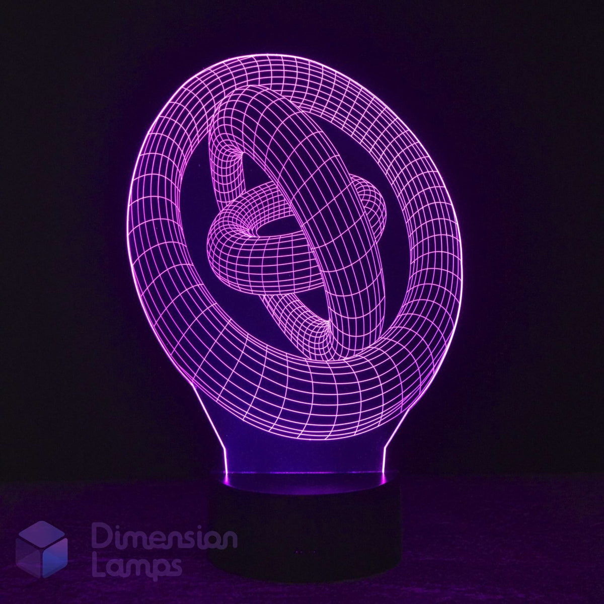 A 3D optical illusion LED night light depicting a glowing purple knot, set against a dark background with a Dimension Lamps in the lower-left corner.