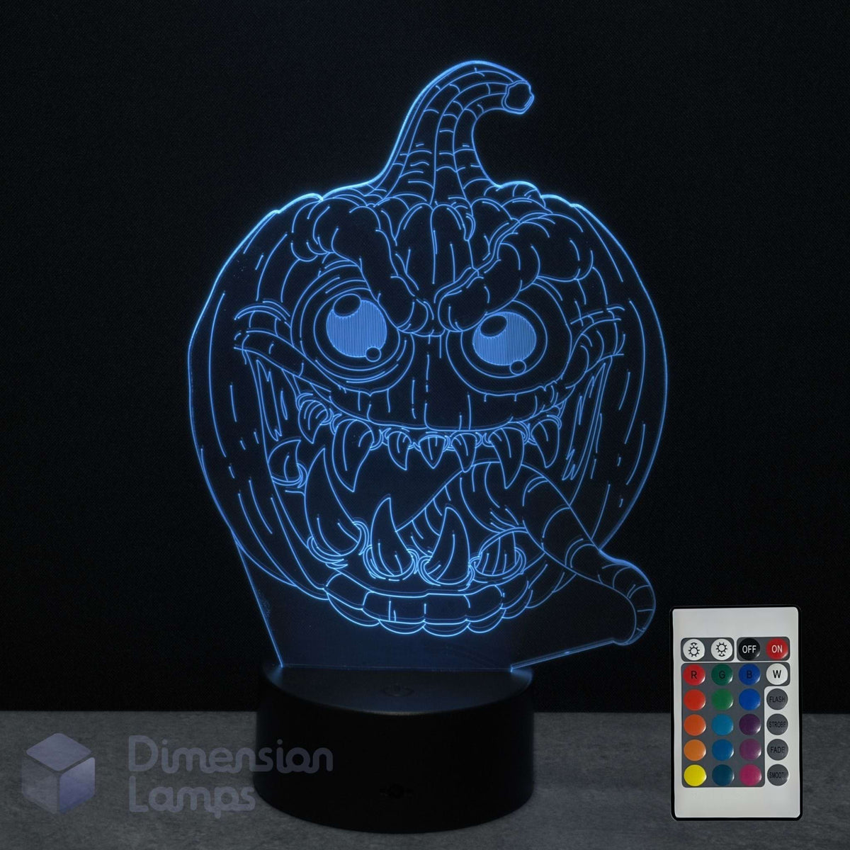 A glowing jack-o'-lantern night light with a black base, on a dark background with a 16 colour remote control and the Dimension Lamps logo visible.
