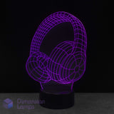 A 3D optical illusion LED lamp shaped like over-ear headphones, glowing with a purple wireframe effect on a black base against a dark background.