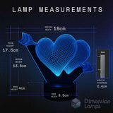 Lamp measurements diagram showing a blue glowing heart-shaped acrylic lamp on a black base, with labelled dimensions including design width 19cm, total height 17.5cm, design height 13.5 cm.