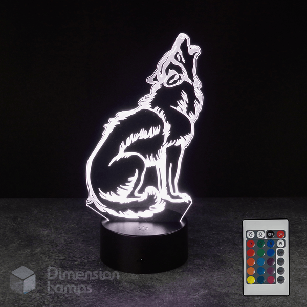 Wolf-shaped night light with remote control on a dark background