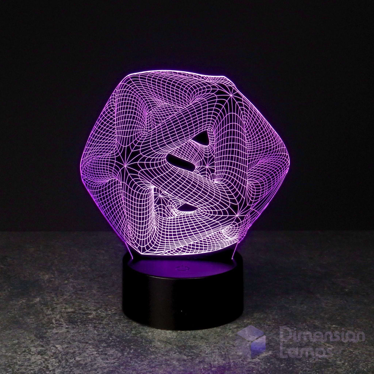 A 3D optical illusion LED lamp with a purple glowing geometric icosahedron design on a black cylindrical base, set against a dark background.