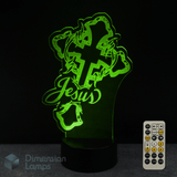 Green LED lamp with 'Jesus' crown of thorns design and remote control on a black background