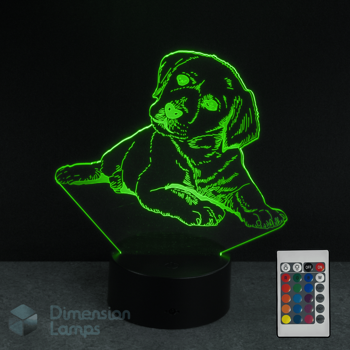 3D LED lamp shaped like a Labrador golden retriever puppy with a remote control on a dark background