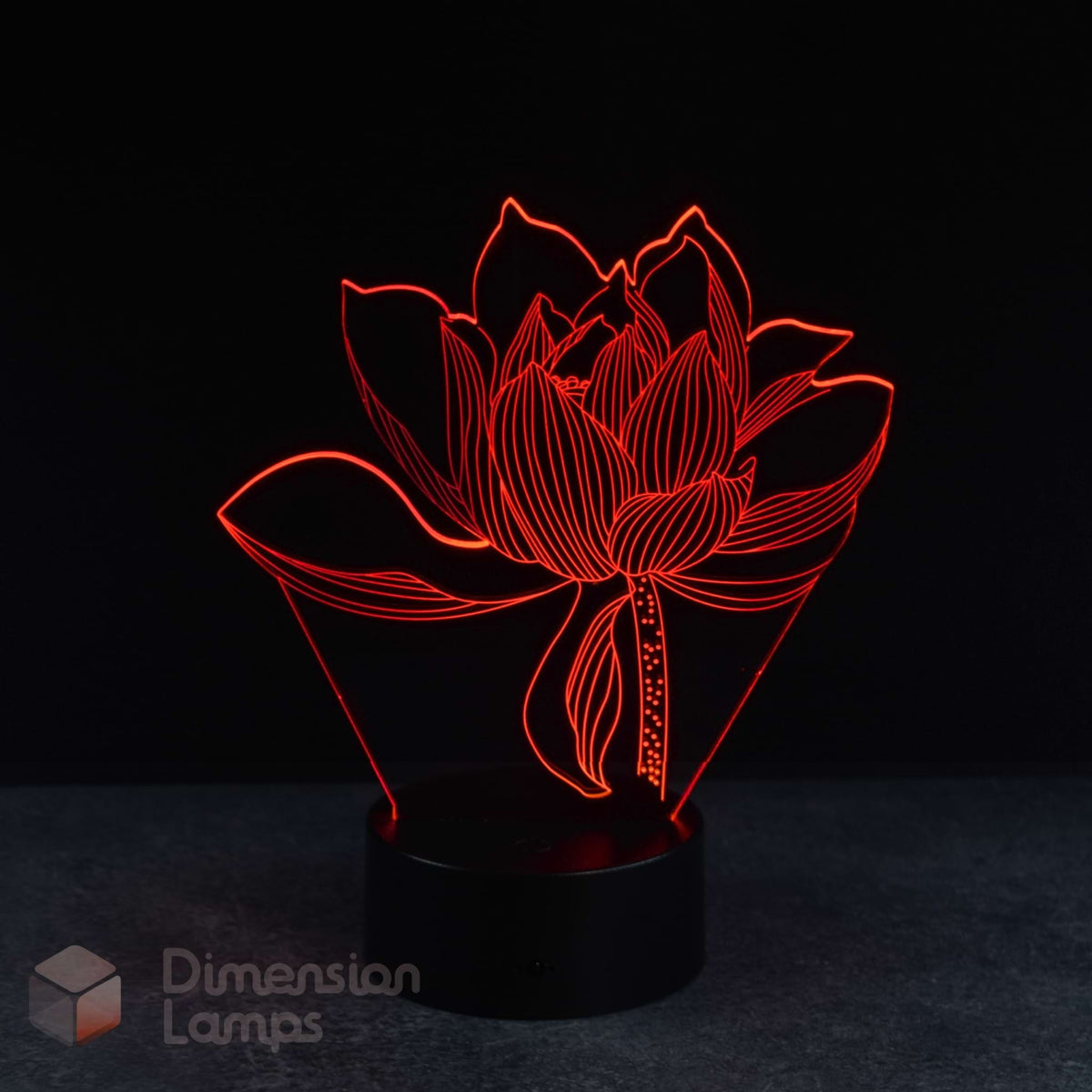 A 3D lamp in the shape of a lotus flower emits a red light, standing on a circular black base against a dark background. This floral design night light would add a warm touch to any space in Australia.