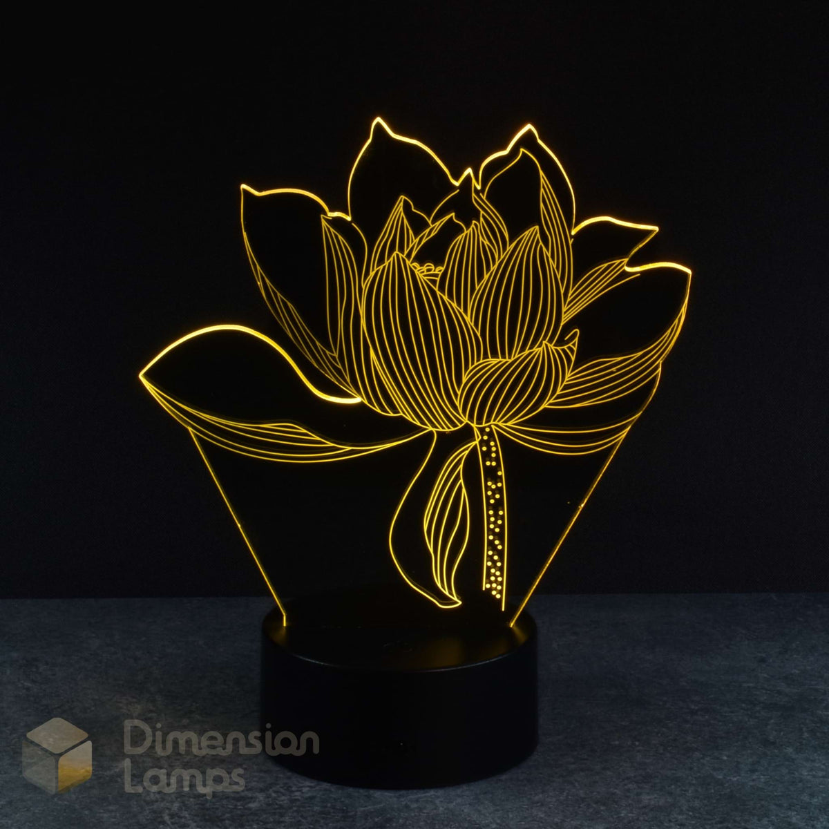 The elegant form of a lotus flower is captured in this 3D lamp, glowing in green. It rests on a round black base, set against a dark backdrop. This unique nightlight offers a peaceful and decorative touch. 