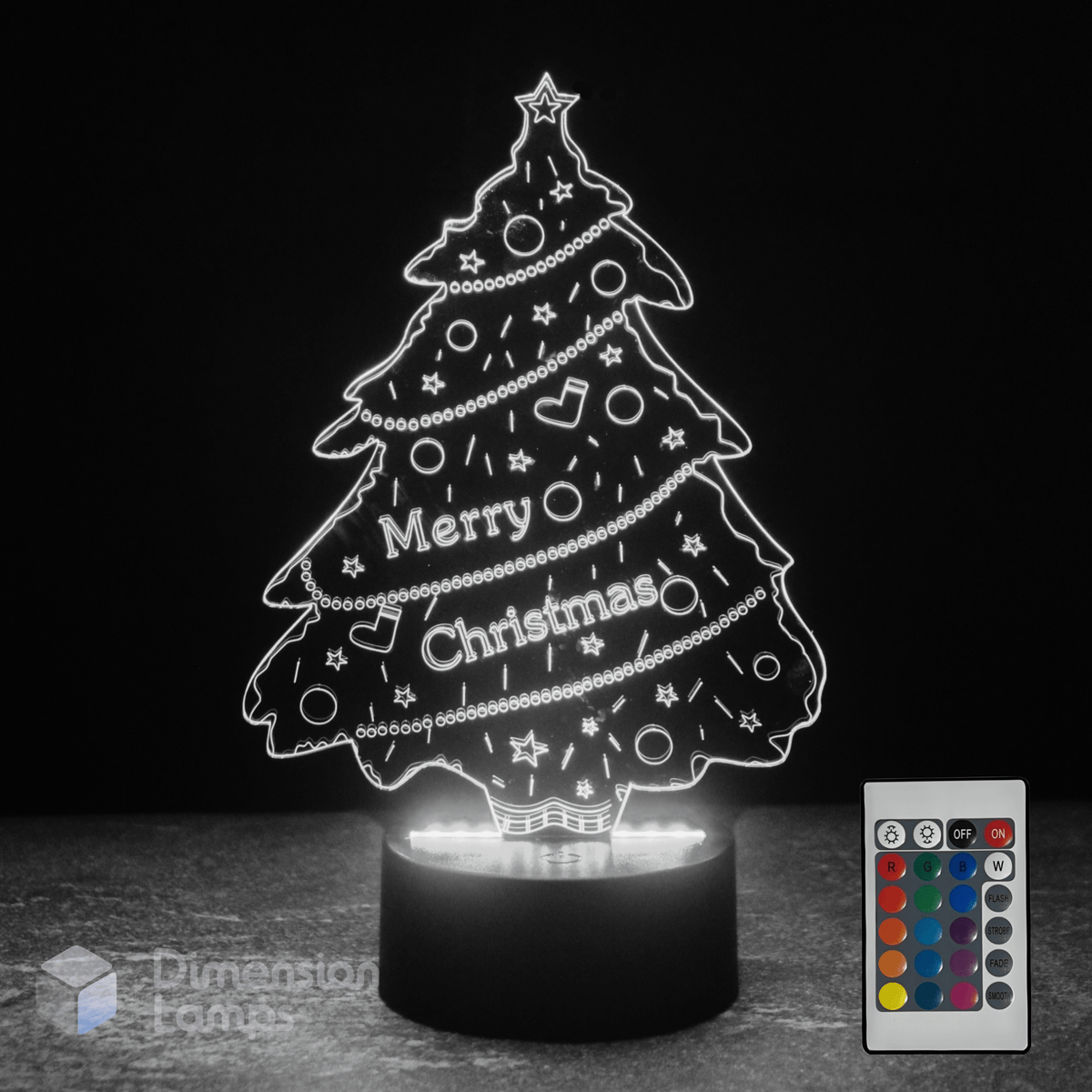 Christmas tree-shaped LED lamp with remote control on a dark background
