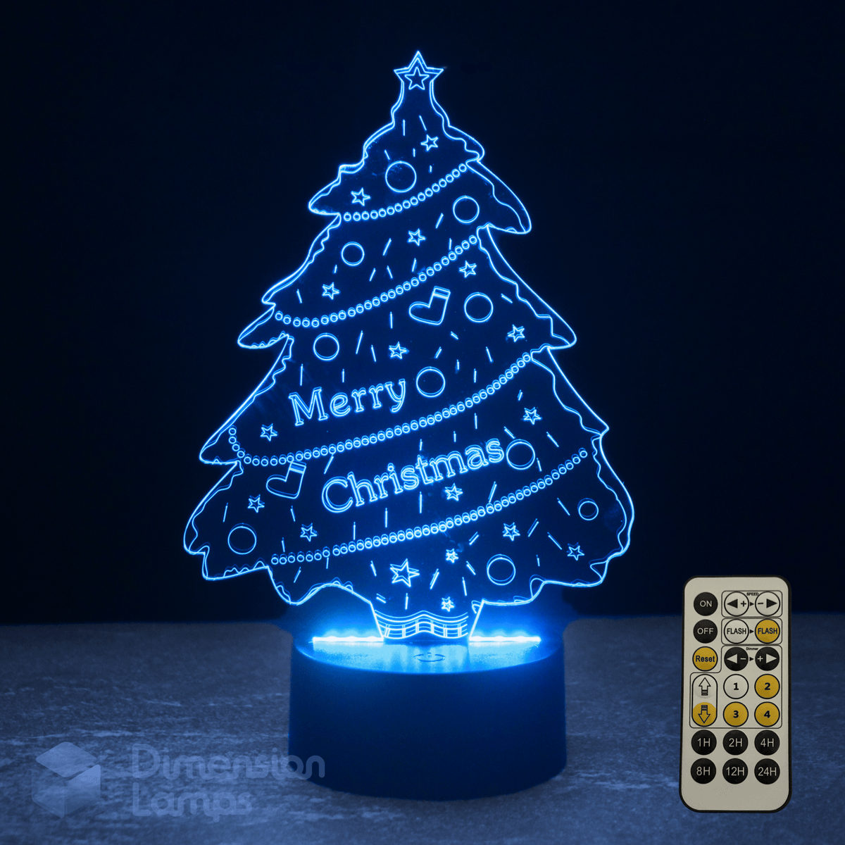 Christmas tree-shaped night light with 'Merry Christmas' text and remote control on a dark background