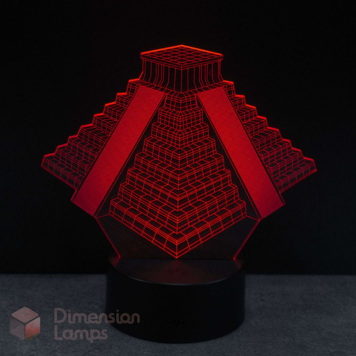 Red pyramid-shaped lamp on a black background with 'Dimension Lamps' branding. Archaeology student gift idea. 